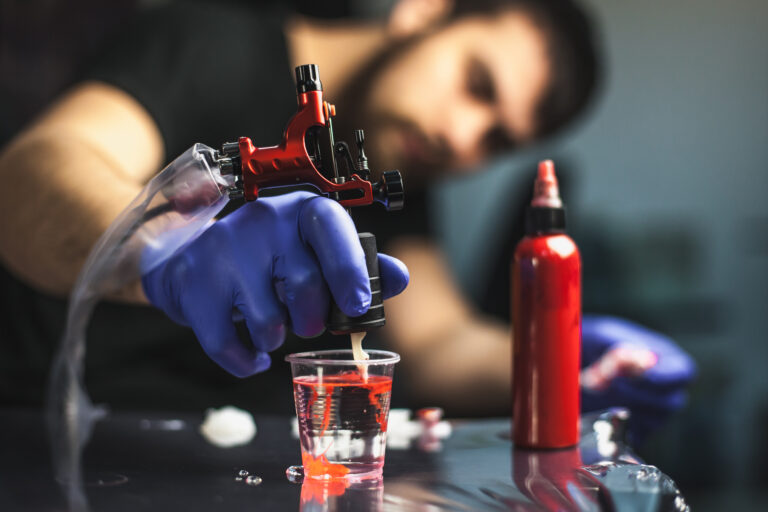 tattooist makes a tattoo. closeup